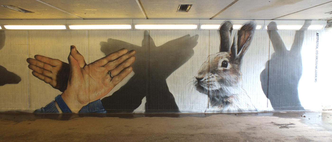 A mural depicting hand puppets