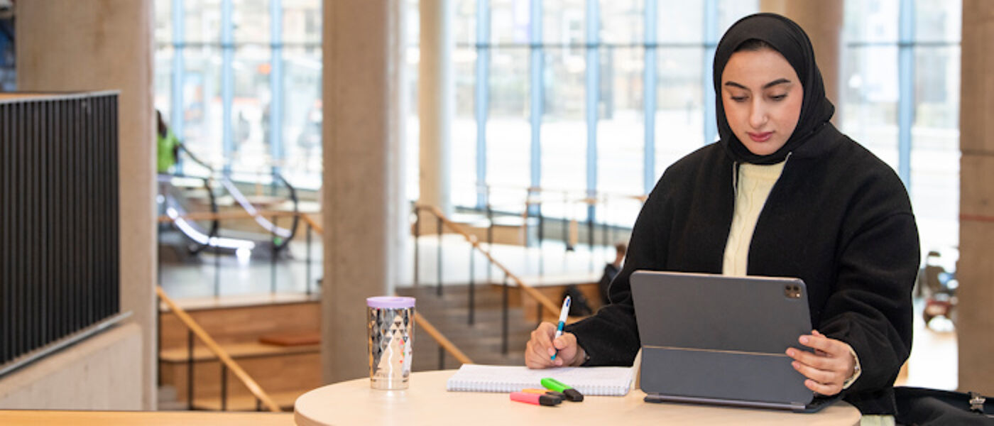 A student using a laptop to study in the James McCune Smith Learning Hub