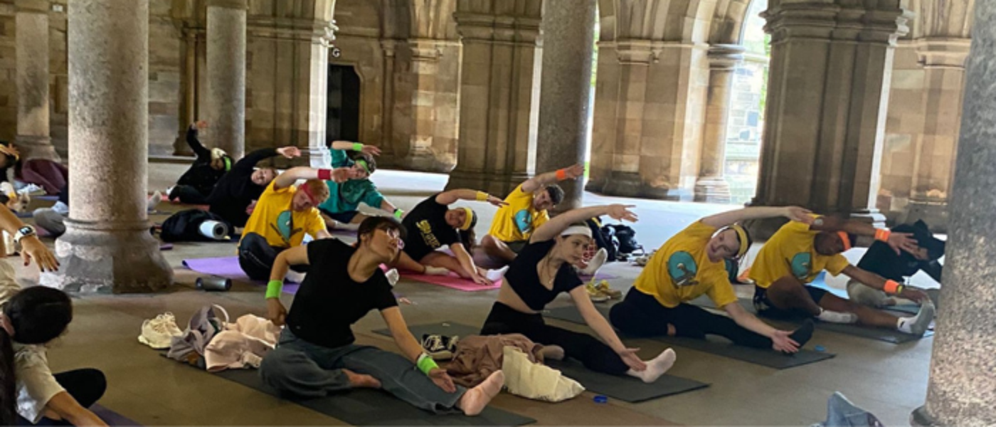 Students doing yoga in the Cloisters