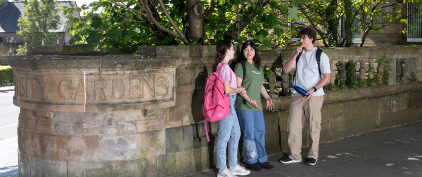 students standing chatting at Uni Grdens