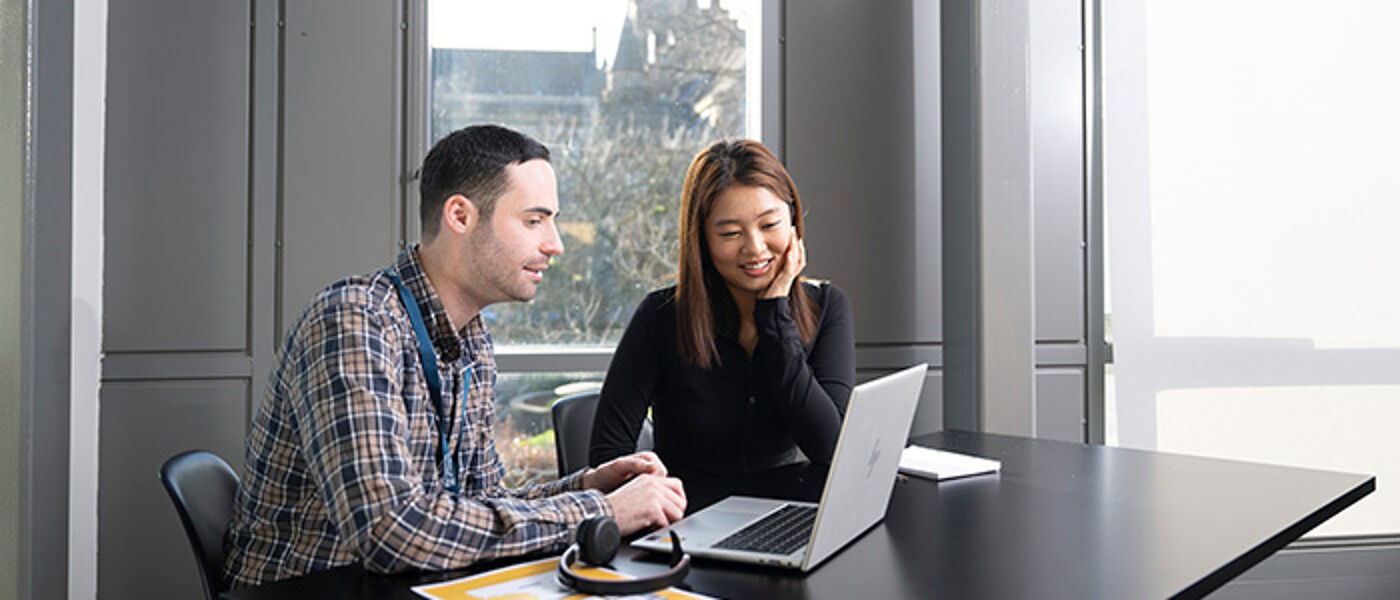 A student is interviewed by staff from Student Services