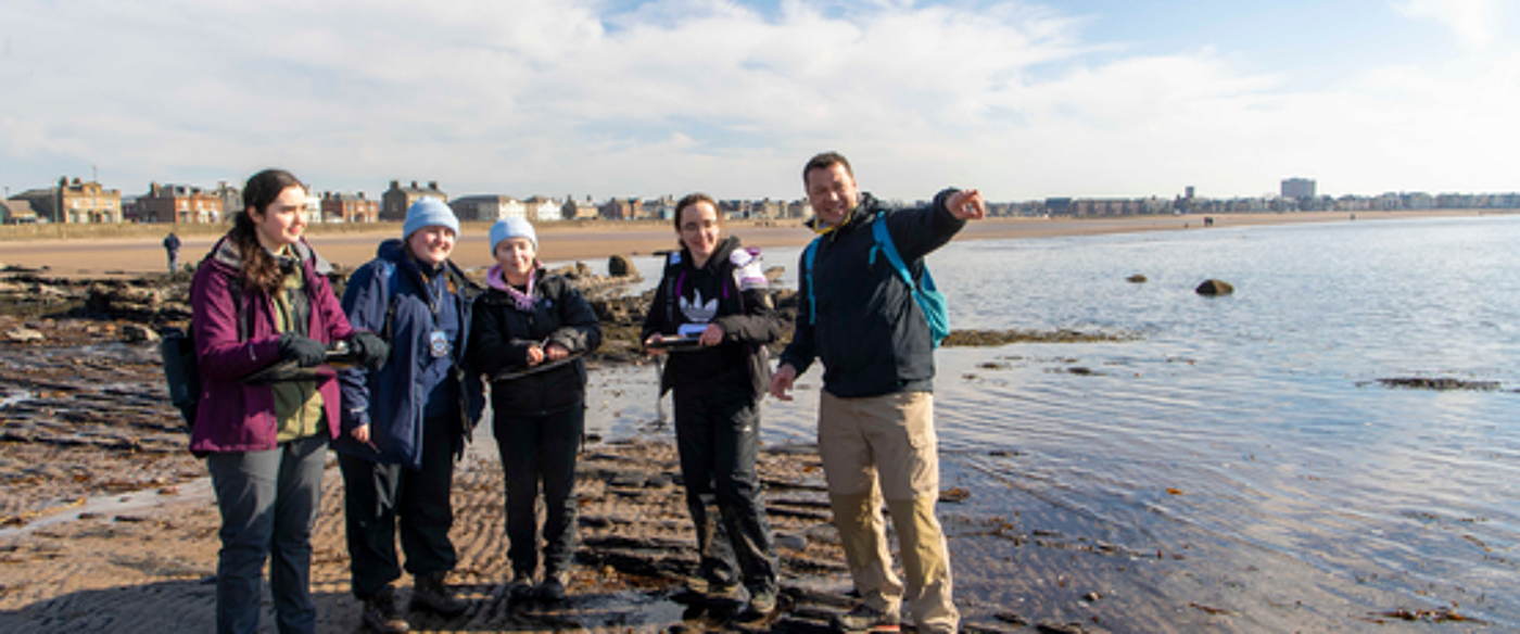 students on a beach