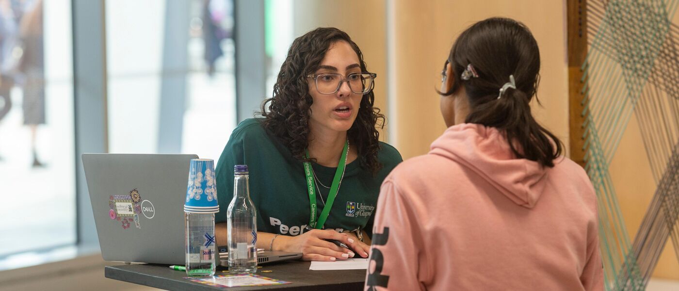 Peer Career Supporter speaking to student at event