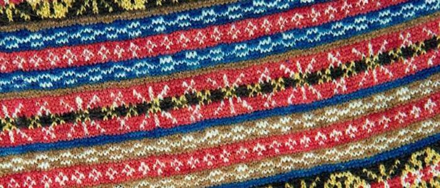 A close-up photograph of a knitted pattern