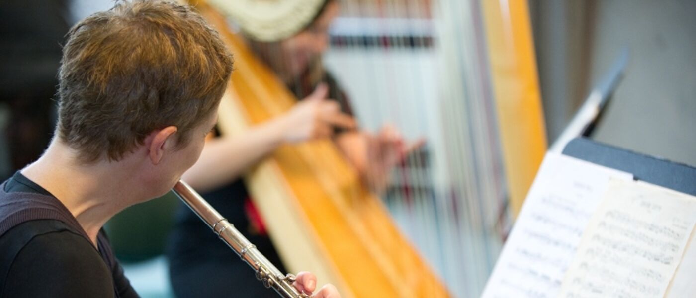 Music student playing flute
