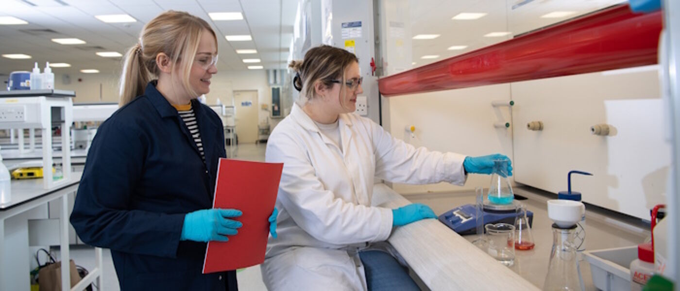 Researchers using lab equipment