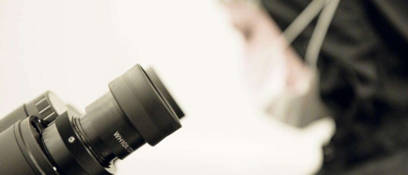 Nanotechnology student using microscope