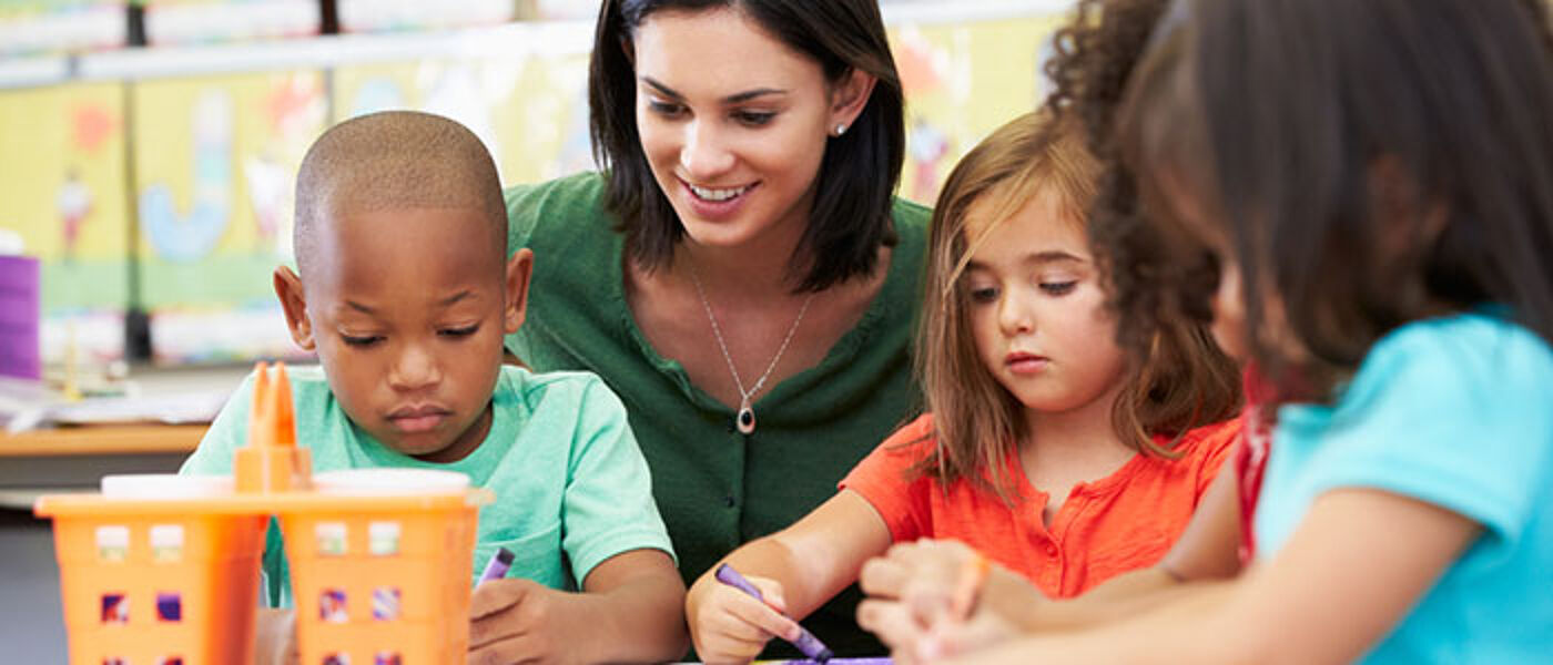 Primary school teacher with pupils