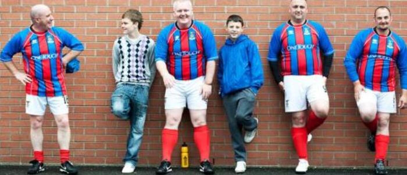 Image of men in football strips