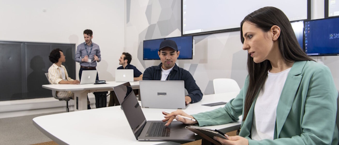 Students studying at desks in the Hugh Fraser Suite