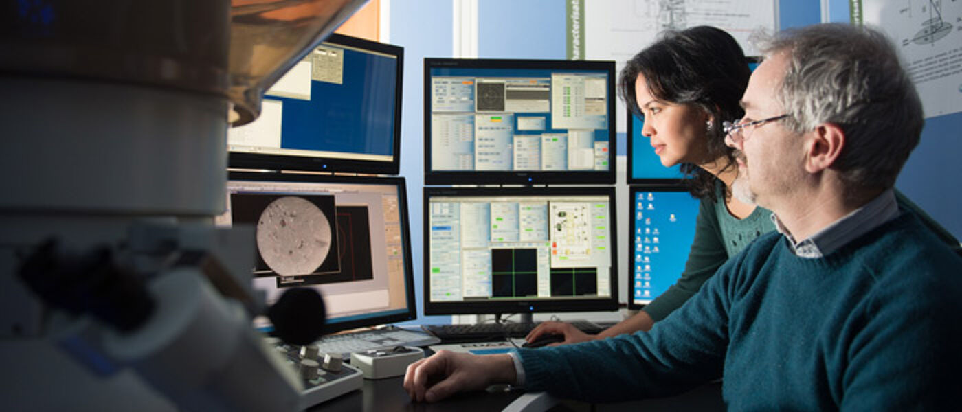 Academics using electron microscope