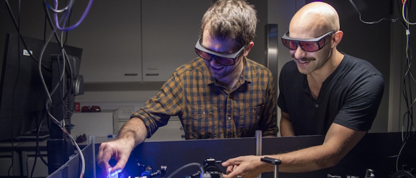 Physics students using quantum equipment