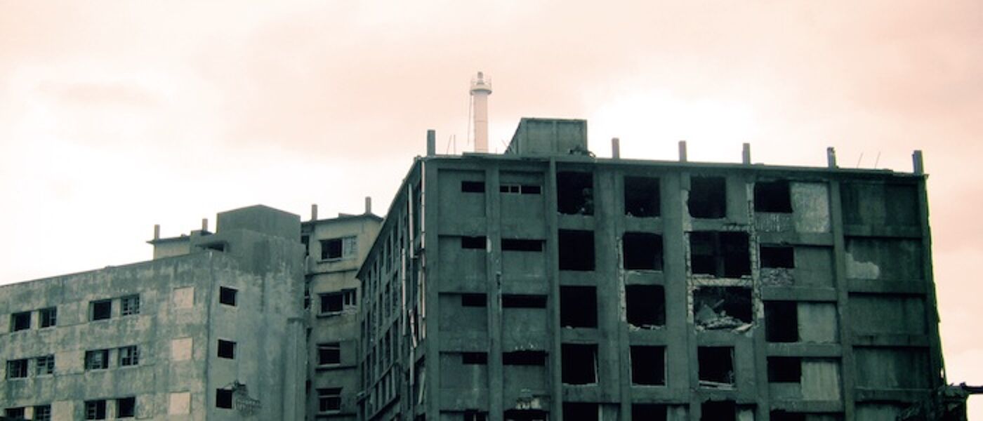 Photograph of ruined buildings on Hashima Island ('Battleship Island'), an abandoned island off the coast of Japan.