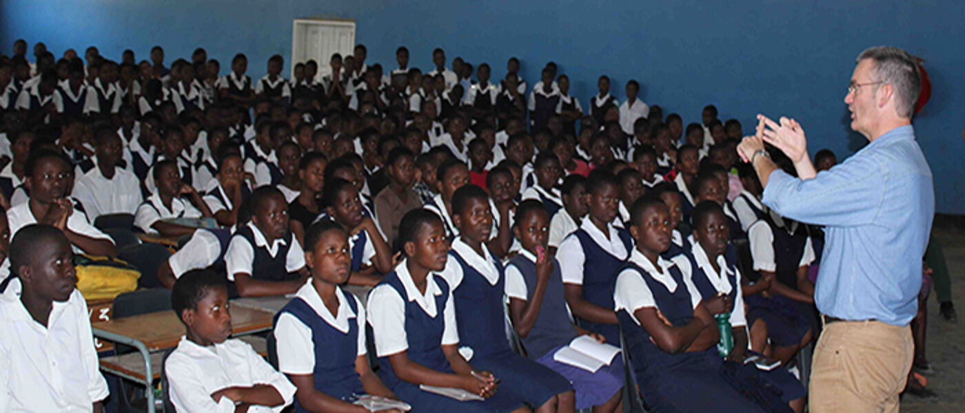 Professor Paul Garside talking to children at Blantyre Secondary School in Malawi