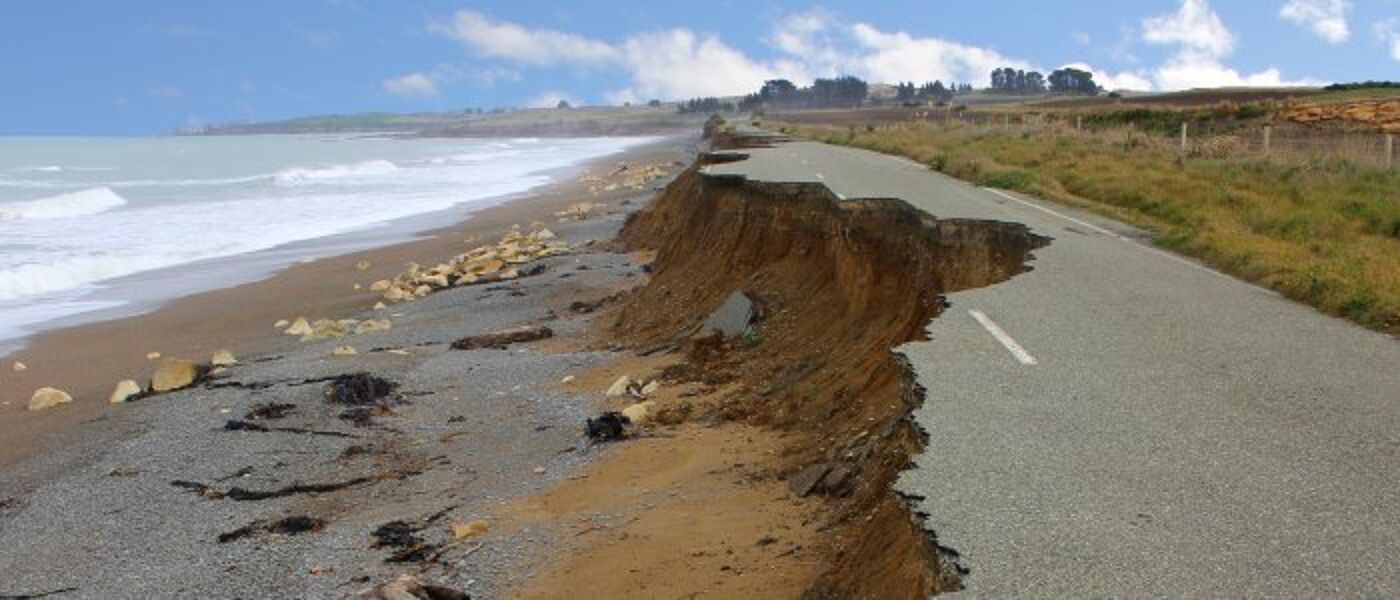shore erosion destroys a road