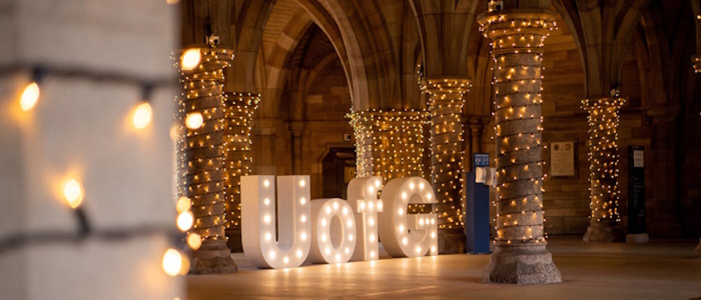 UofG letters lit up in undercroft during graduation