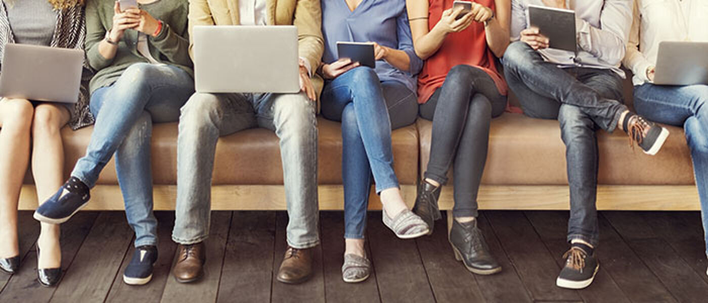 people using laptops and mobile devices