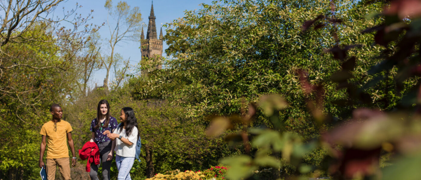 Three students walking in Kelvingrove Park