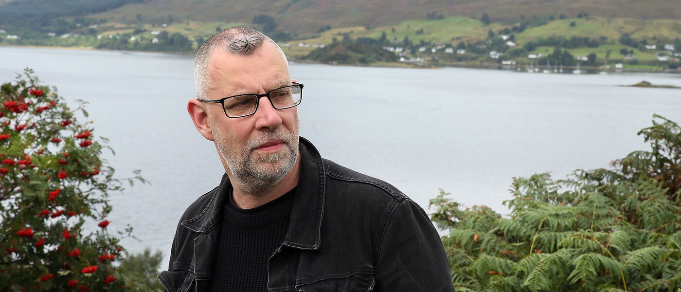 Graeme Macrae Burnet (MA 1989) by a Loch in the Highlands