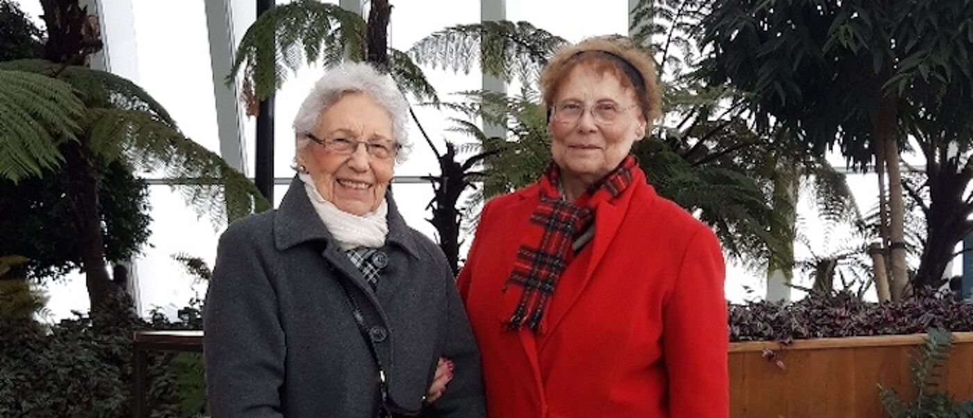 Two women together in a botanics house