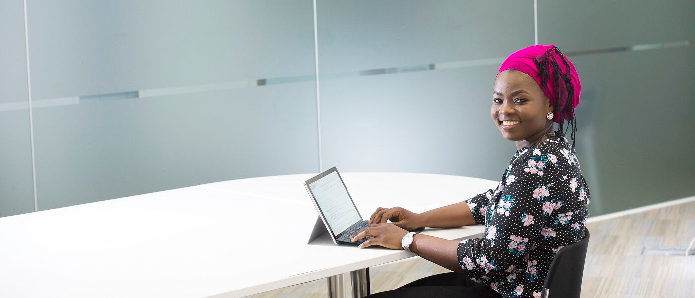 Academic working at laptop in the School of Computing Scinece