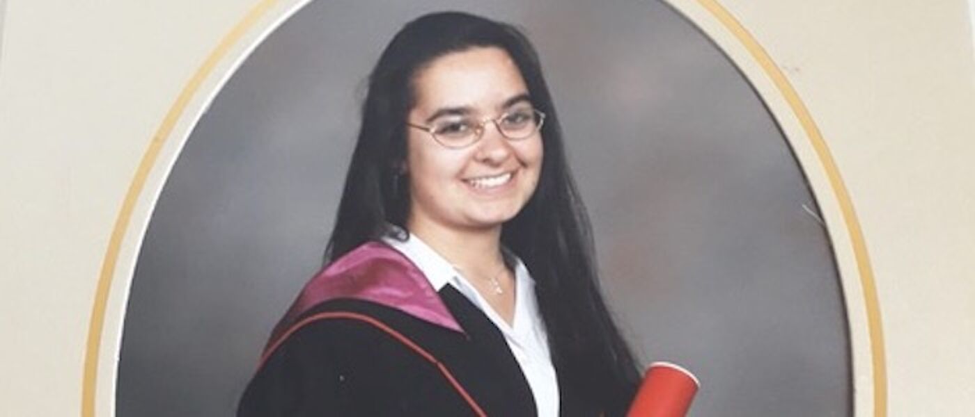 Portrait of female graduate with scroll
