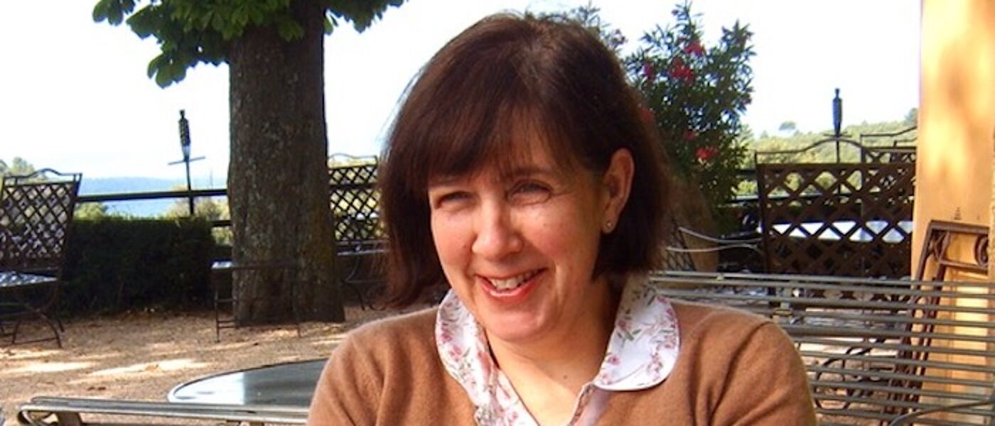 A woman on holiday laughing