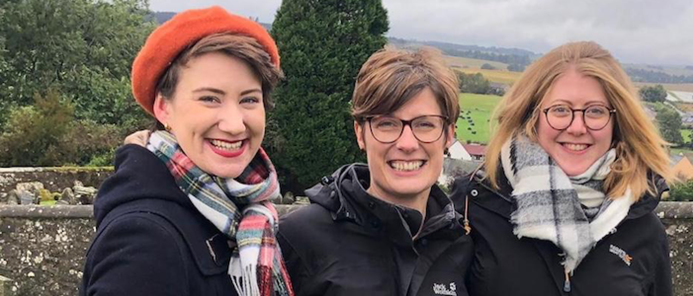 Three women together smiling