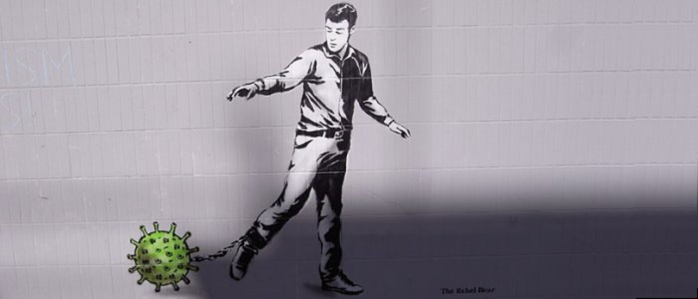 graffiti - man with coronavirus as ball and chain - the rebel bear