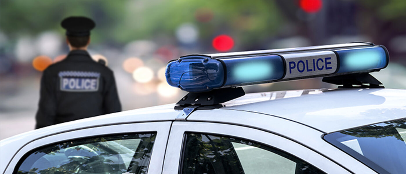 Police man and car lights