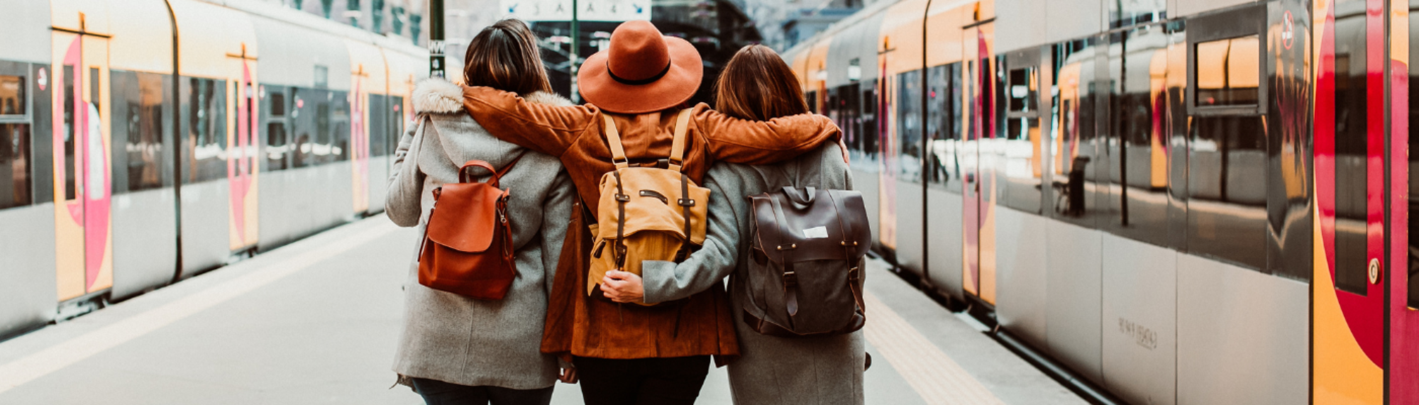 A group of young friends waiting relaxed and carefree at the station in Porto, Portugal before catching a train