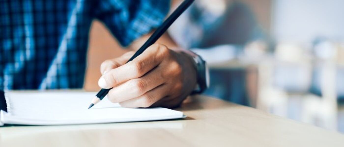 Student sitting in-person exam
