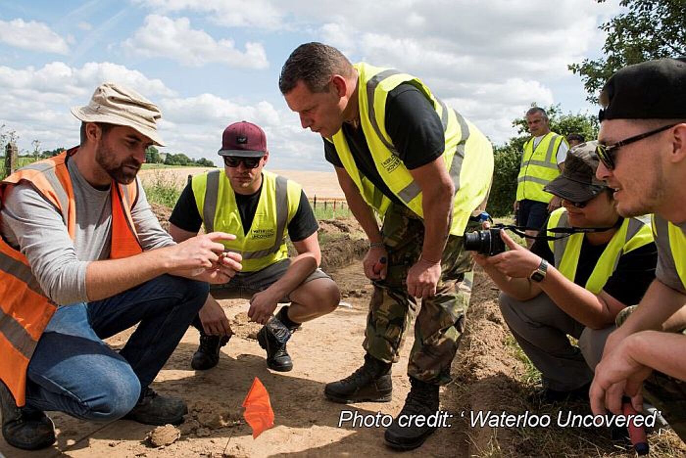 Military veterans discussing after an archaeological dig. Photo courtesy Waterloo uncovered.