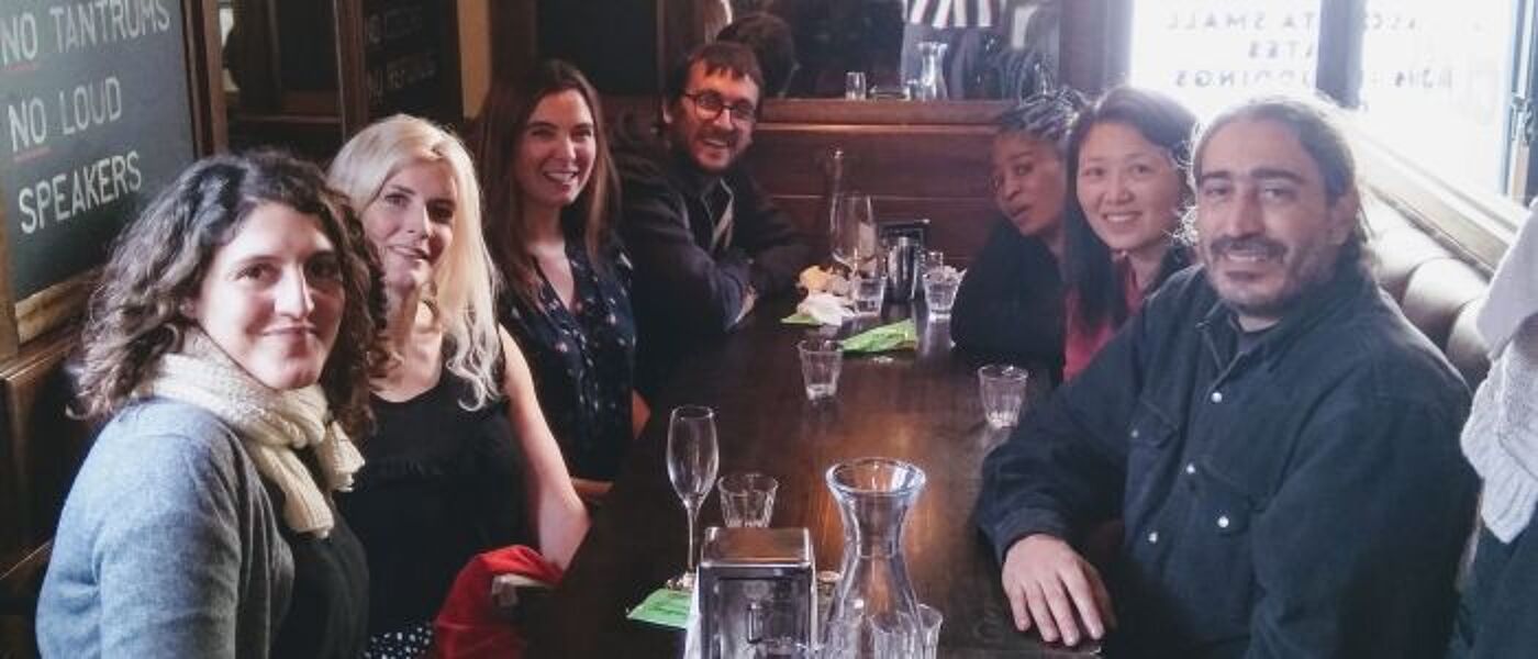 Group of people round a table in the pub