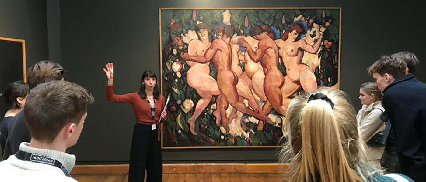 A student giving a tour of the Hunterian Art Gallery