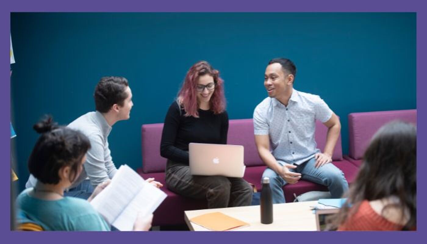 group of people sitting around a table working and discussion