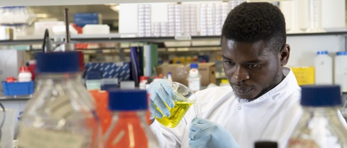 Male doing an experiment with liquid