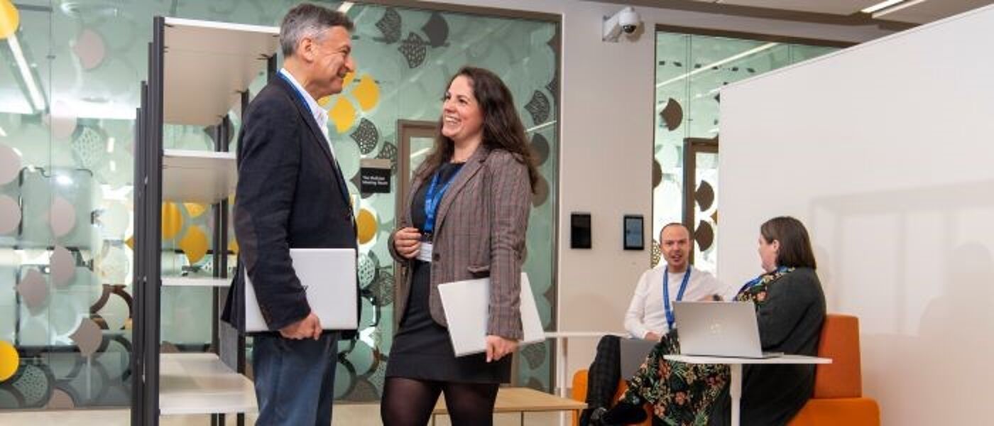image of staff holding their laptops